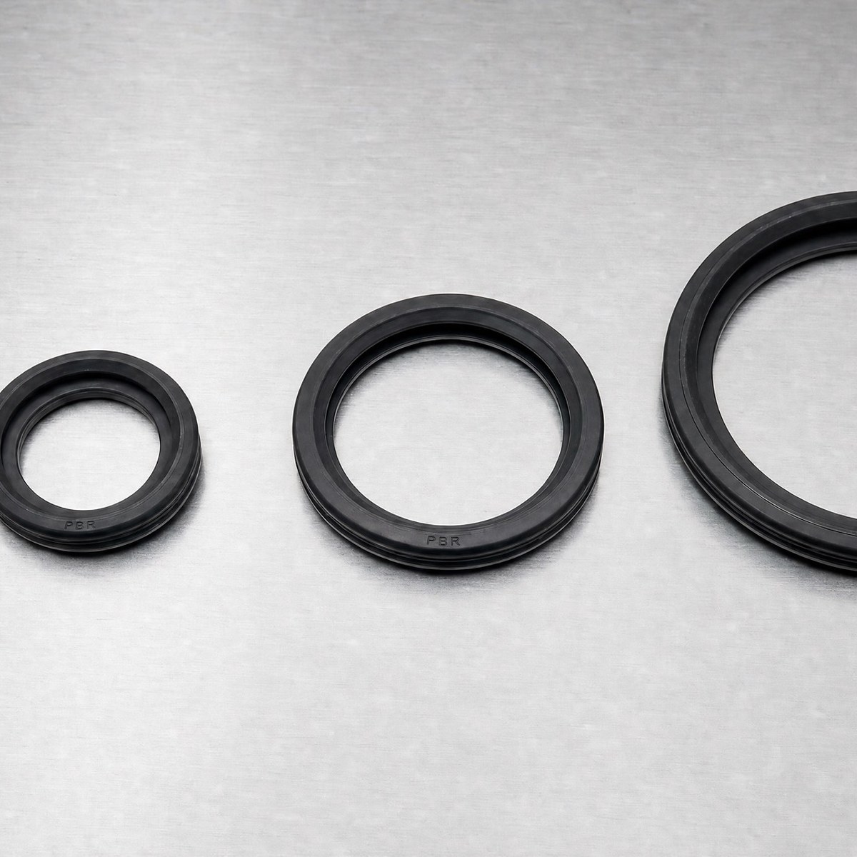 PBR-branded oil seal rings in four diameters — black NBR rubber with embossed PBR mark